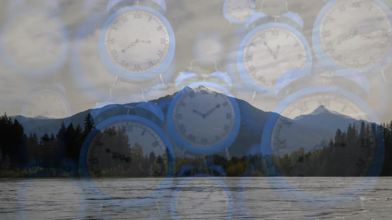 Playback starting causing analog alarm clocks floating over lake, snowy peak forest for meditation