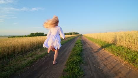 woman running through a wheat field