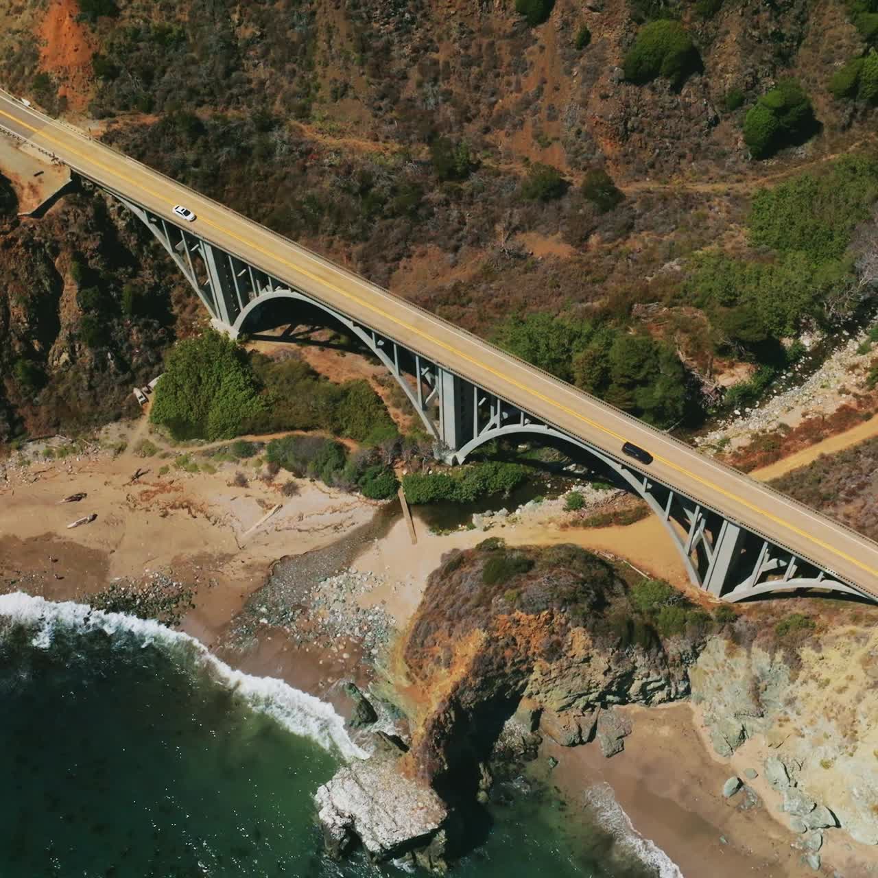 Aerial view of big bridge on rocky landscape. Bixby Creek Bridge on the Big Sur coast of California