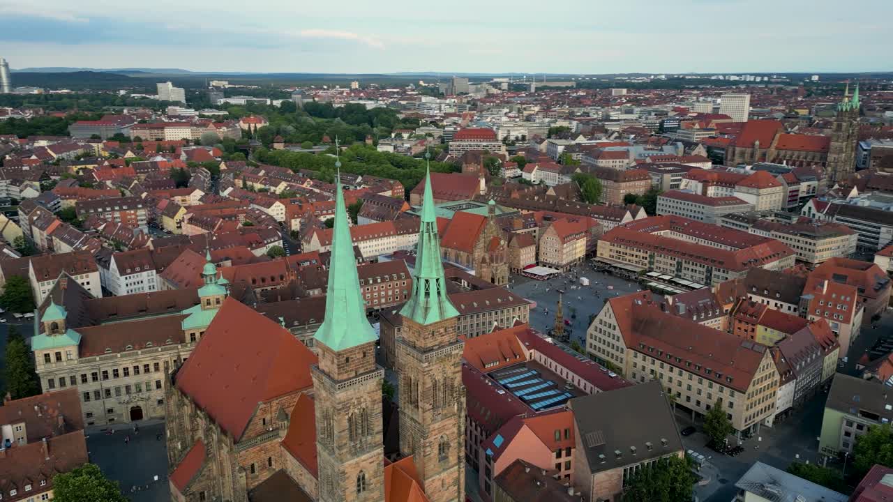 4K Aerial Drone Video of Medieval Sebalduskirche Church with twin spiers in Nurnberg, Germany - Truck left