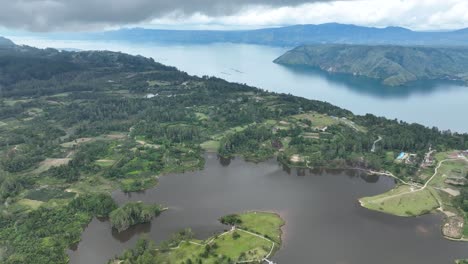 Pea-aeknetonang-lake-on-samosir-island-within-lake-toba,-lush-landscapes,-aerial-view