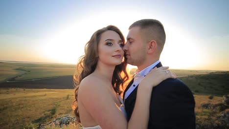 beautiful wedding couple kiss on the sunset in the mountains beautiful wedding couple kiss on the sunset in the mountains