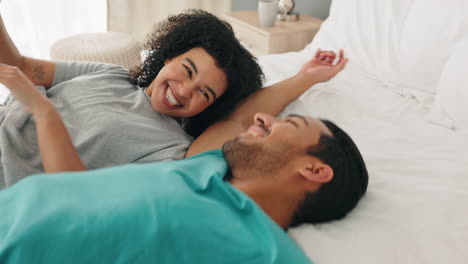 love, couple and hair stroke on bed in home