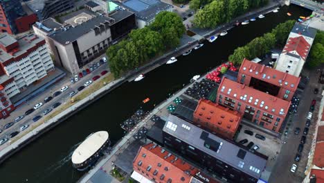 aerial view of the boats dock at dane river near the castle bridge in pilies tiltas, klaipeda, lithuania