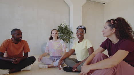 young people chatting in dance studio