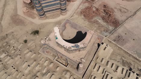 A-cinematic-view-of-Uch-Sharif-Jawindi-Bibi-Tomb-picturesque-view-on-a-sunny-blue-sky-day