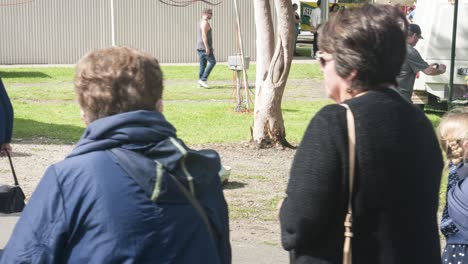 timelapse of people taking photos with large clogs at the holland festival in the outer suburbs of melbourne, victoria, australia, march 2020.