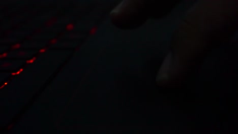 finger make move on the laptop pointer pad in dark room