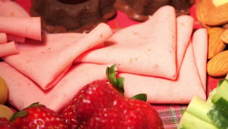 pink ham, strawberries, and olives appetizer