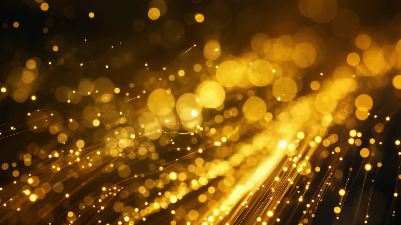 Golden particles floating and flowing across dark background, generating magical festive atmosphere with shimmering luxurious energy
