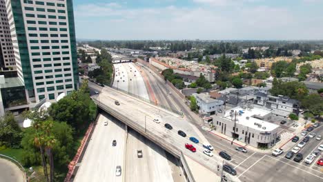 route 134 freeway in burbank, california - ascending aerial view in the downtown area and an overpass