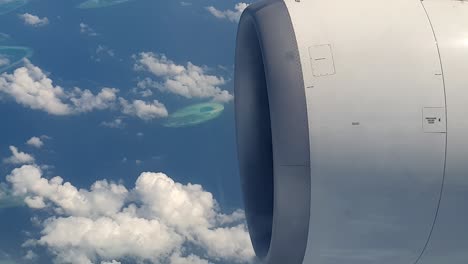 aerial shot of beautiful turquoise atolls of maldives archipelago from airplane