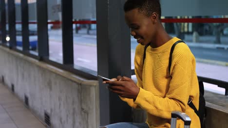 woman using mobile phone in subway 4k