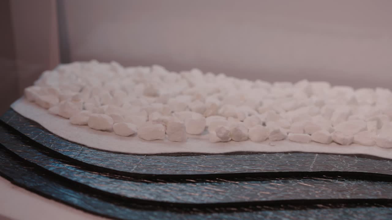 White stones and textured layers create a calming abstract landscape