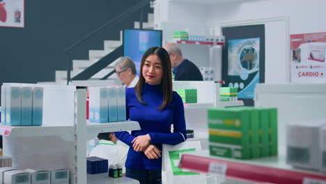 smiling customer amidst pharmacy shelves