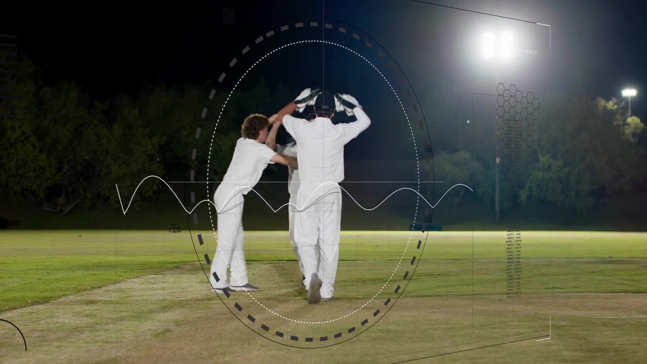 Tre spillere på en cricketbane, bolden kommer, keeperen griber den og sikrer gærdet, mens et overlay sporer keeperen.