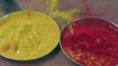 indian women close-up of face smeared with bright holi colors