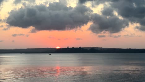 Beautiful ocean landscape sun setting behind horizon on coast of Kenya