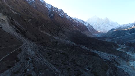 Backward-Aerial-Sweep-of-Bhojbasa,-situated-at-trekking-distance-of-about-14km-from-main-Gangotri,-Uttarakhand,-India