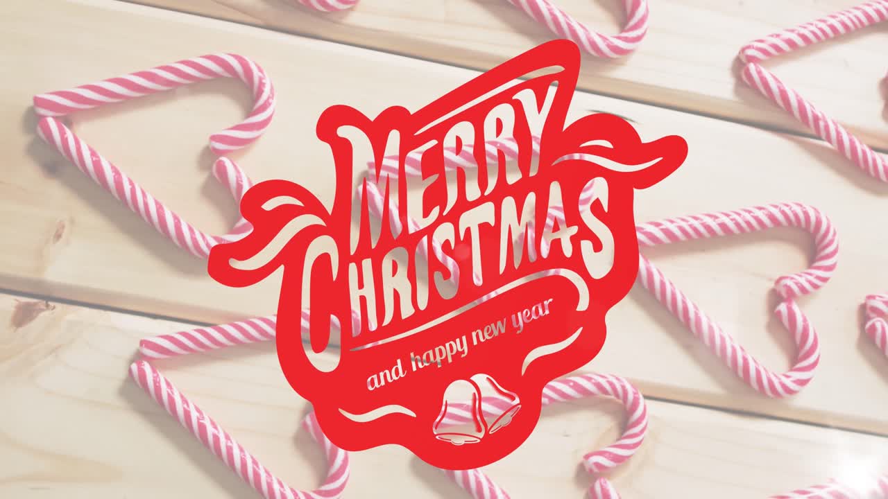 나무 배경 에 있는 사탕 위 에 메리 크리스마스 와 행복 한 새해 문자 의 애니메이션