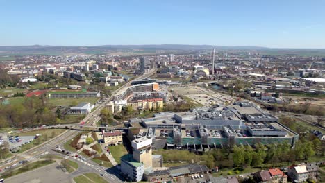 panorama of the city of olomouc with passing cars and public transport around the å antovka department store, czech republic - aerial view