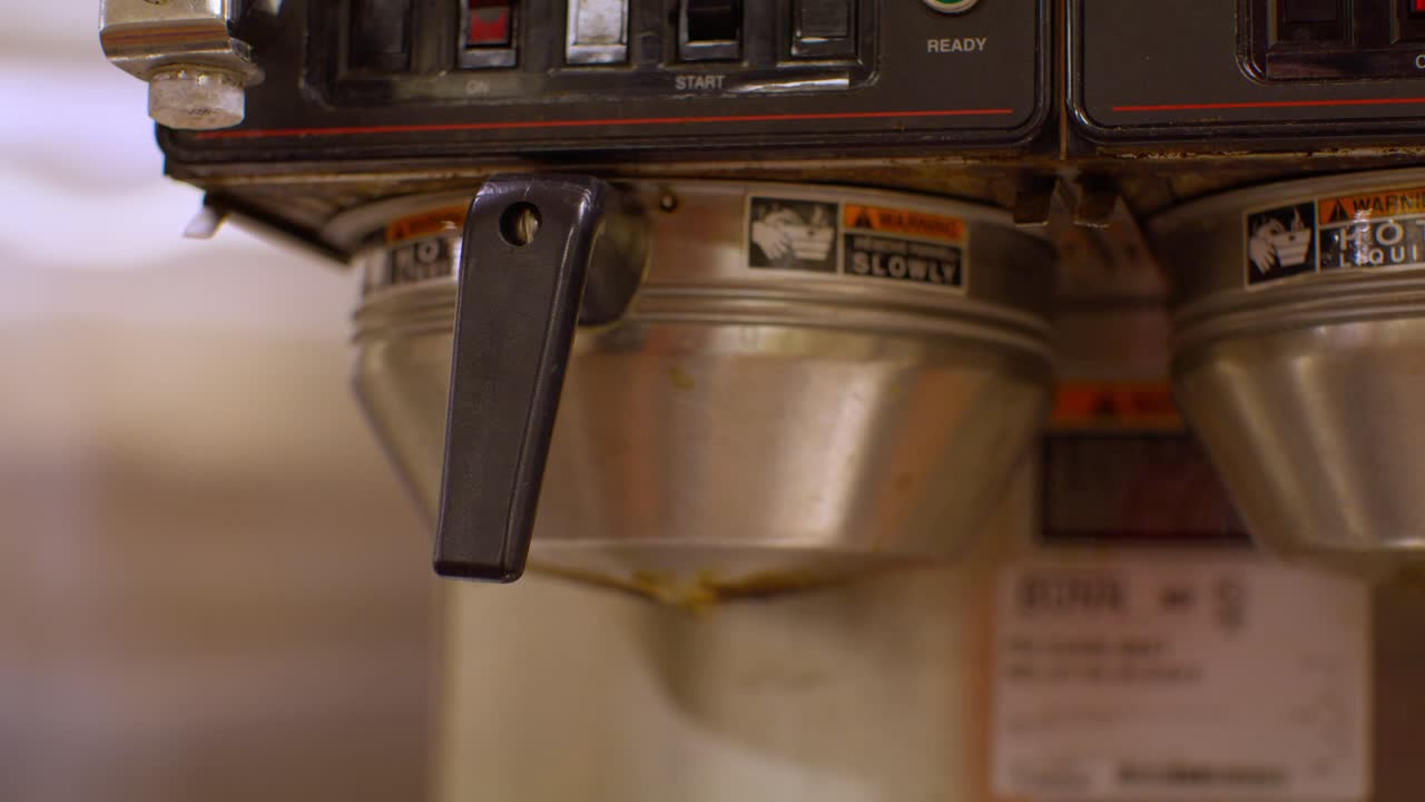Close up of industrial coffee maker with stable video shot.