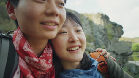 asian female couple enjoying nature on hike