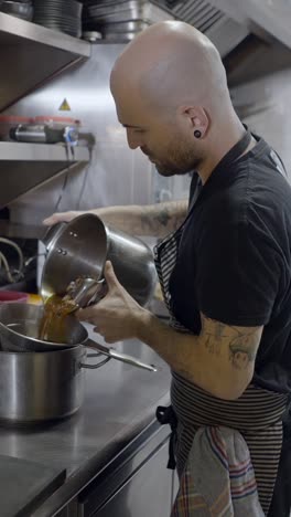 chef straining liquid in a professional kitchen