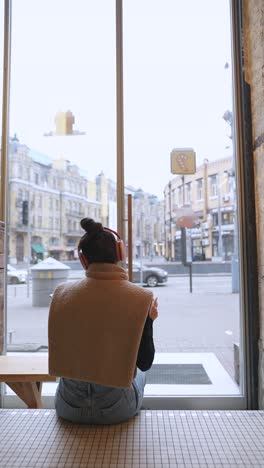 woman enjoying coffee in a cozy cafe