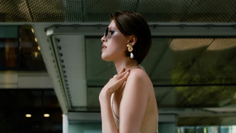 side view of elegant woman in sunglases