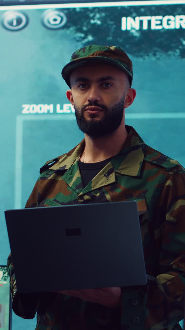 Military Man in Camouflage Uniform Using Laptop in Control Room