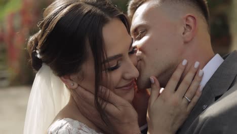 portrait of lovely newlyweds caucasian bride embracing groom, wedding couple family hugging