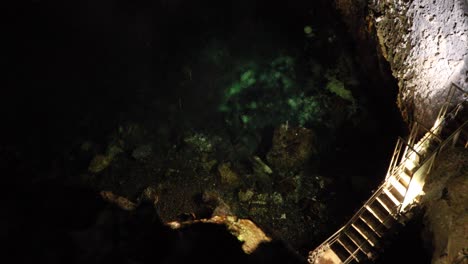 crystal clear lake formed by rainwater at the bottom of algar do carvao in azores, portugal