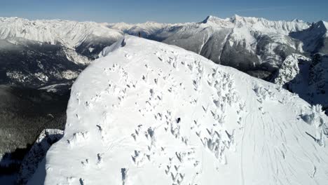 Skier-skiing-on-a-snow-capped-mountain-4k