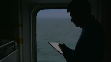 man using touch pad during the cruise