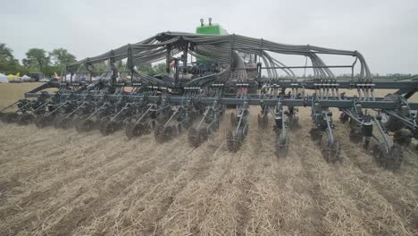 demonstration of agricultural machinery at an exhibition. tractors operate in the field, showcasing their capabilities and performance in action