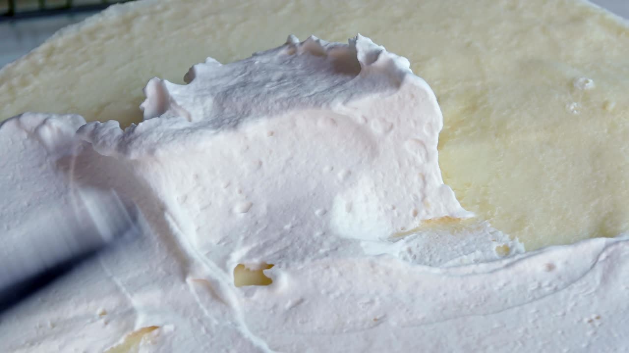 Make a whipped cream on the cake.