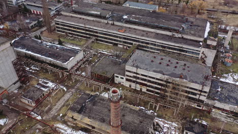 old industrial zone with ruined buildings. empty abandoned factory with brick edifices in place. large aged enterprise. top view.
