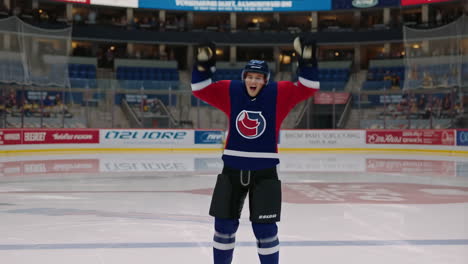 young hockey goalie celebrates victory on ice