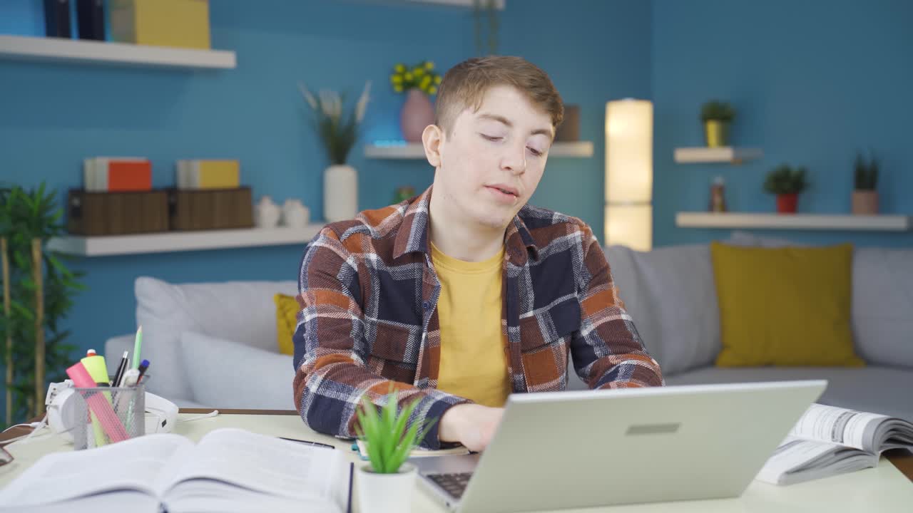 The sleepy student yawns.