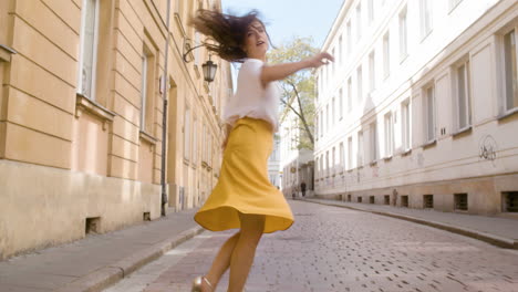 beautiful woman dancing latin dance alone in the old town street 1