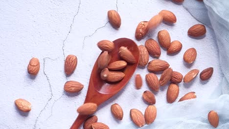 almonds in a wooden spoon