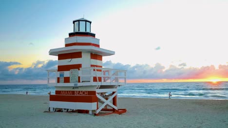 miami south beach sunrise with lifeguard tower and coastline with colorful cloud and blue sky, south beach, miami beach. florida