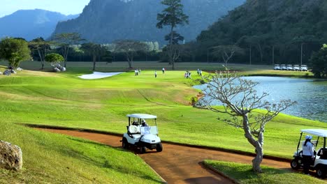 golf course with lush green fairway and mountains