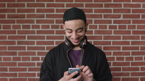 attractive-young-hispanic-man-portrait-of-student-using-smartphone-texting-browsing