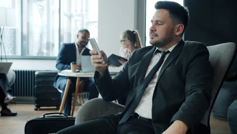 businessman at airport lounge