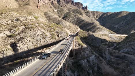 cars driving on bridge going over canyon. us highway 60 queen creek bridge in superior, arizona