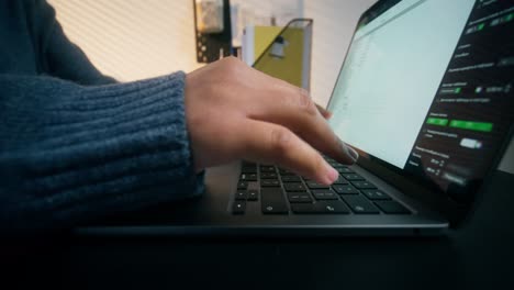 person typing on a laptop