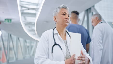 Healthcare,-documents-and-a-woman-doctor-walking