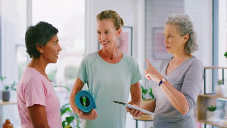 two pilates members signing up for a health